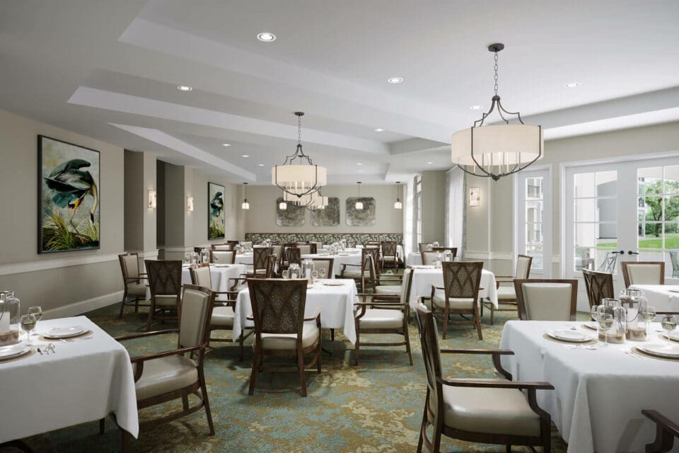 3D digital rendering of form dining room filled with dark wood tables and chairs covered by white tablecloths., beige walls green and beige patterned carpeting, cream and bronze chandeliers as well as paintings at back of room and windows to the right.